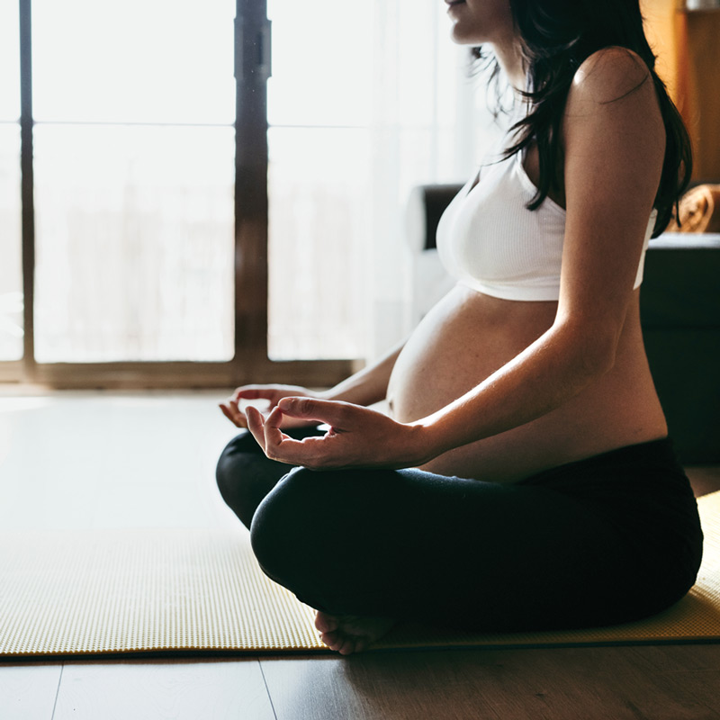 Pregnant woman calm and meditating.
